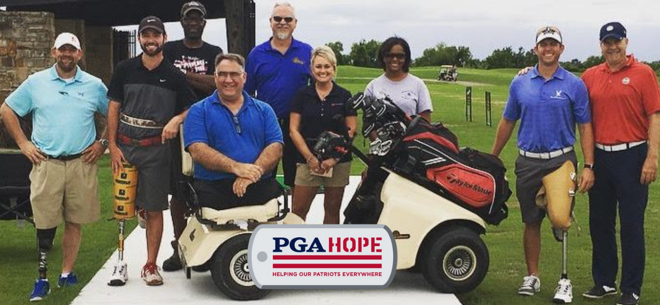 Veterans golf clinic group with the PGA HOPE mark visible in the photograph