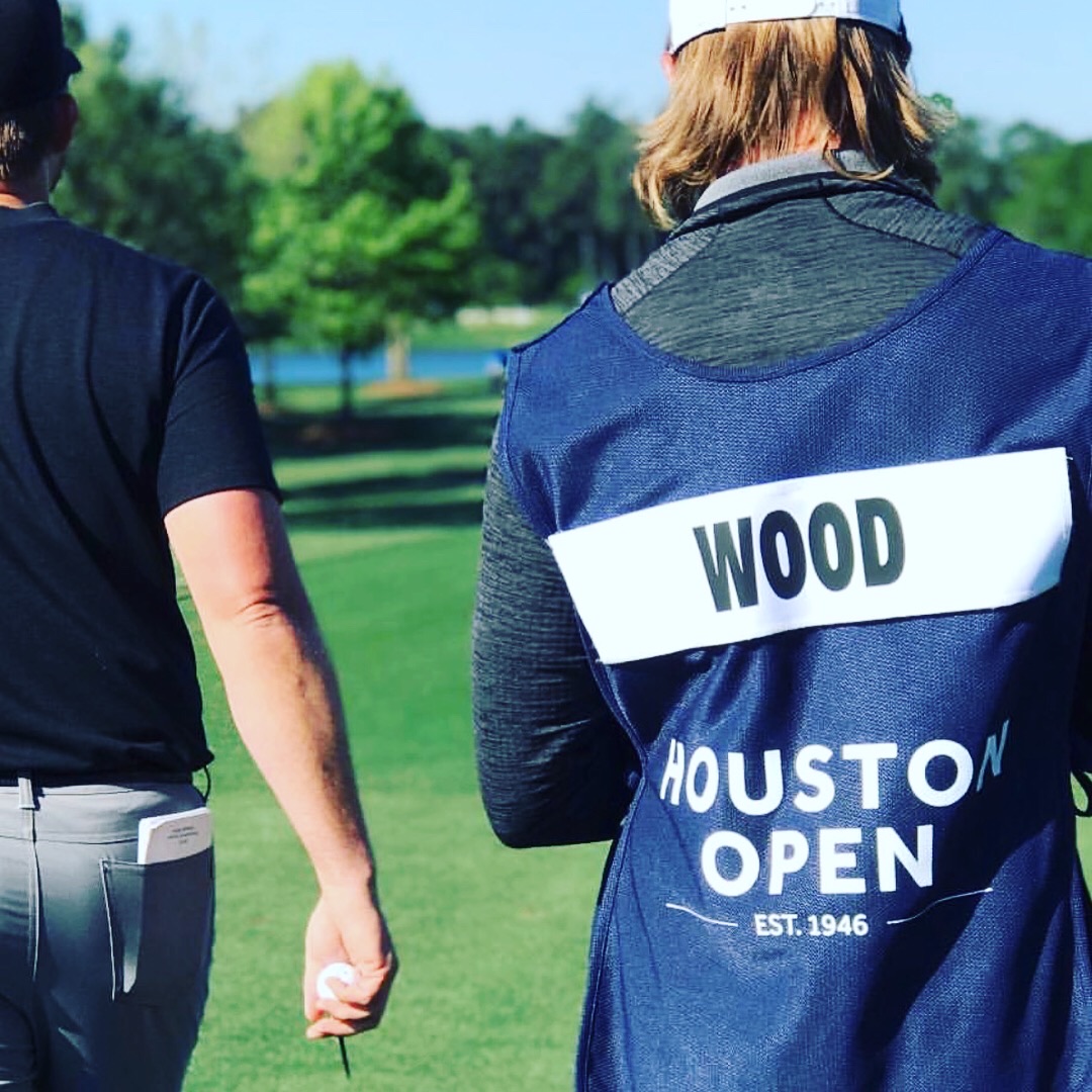 JJ Wood walking at the Houston Open alongside his caddie