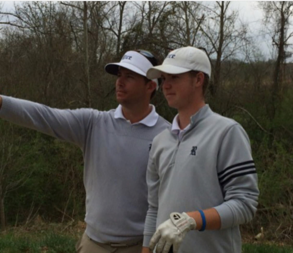 JJ Wood at left discussing on-course strategy with a Rice University golfer